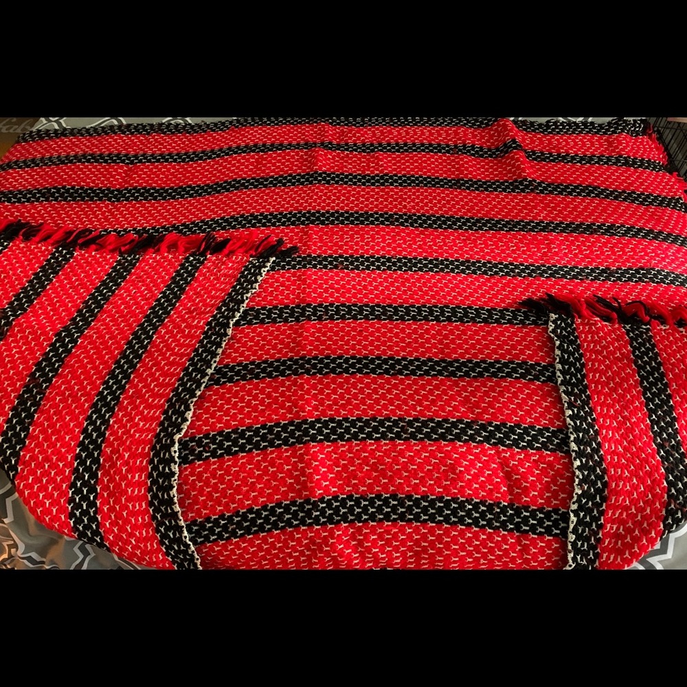 Red and black knitted throw blanket.